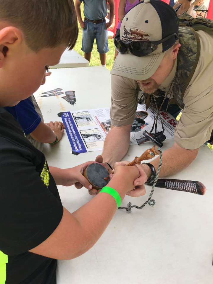 man teaching a boy