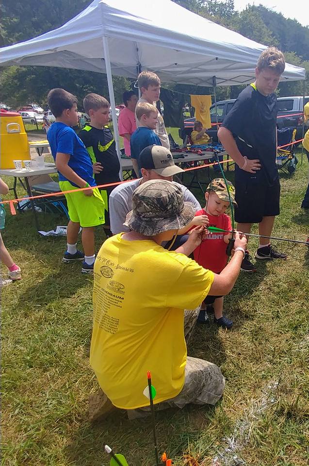 child learning archery