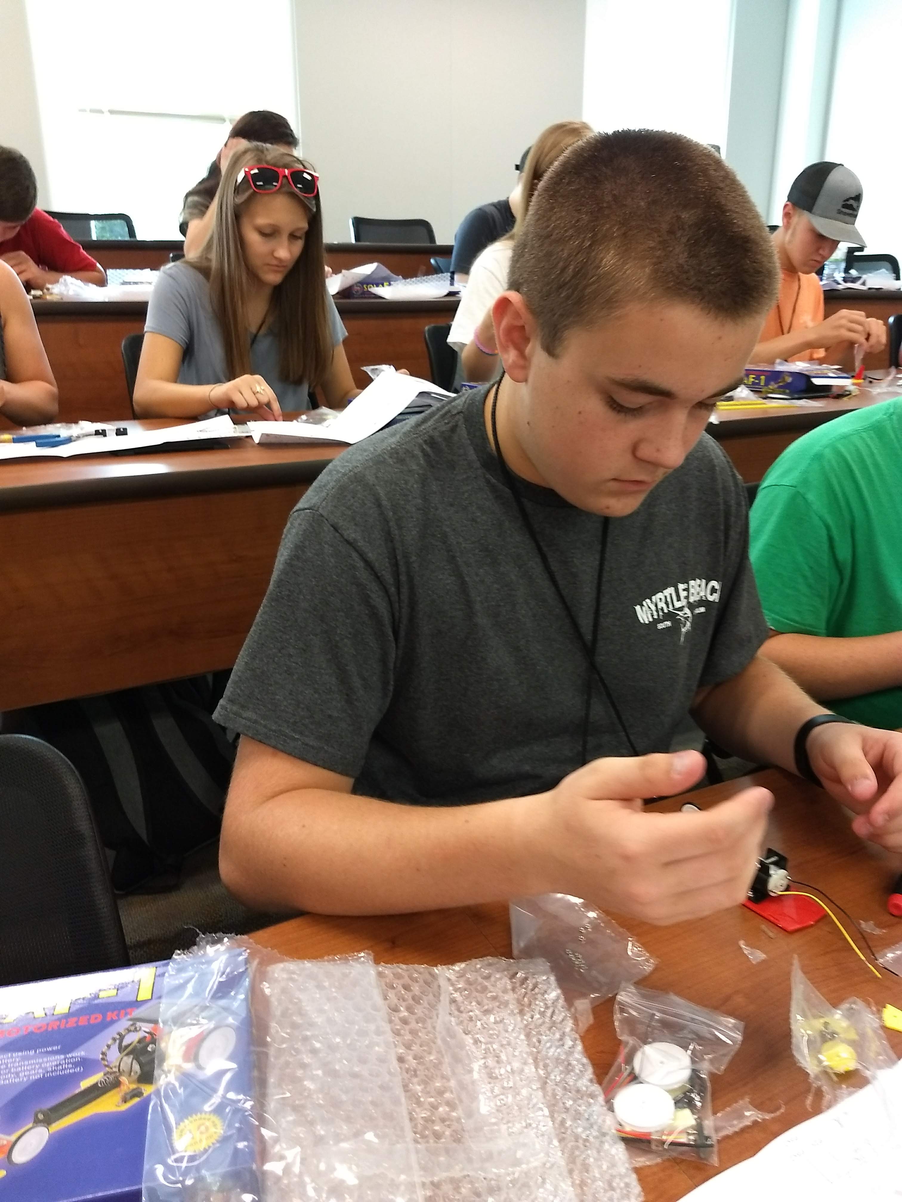 Isaac Brown working on his solar car during the renewable energy workshop