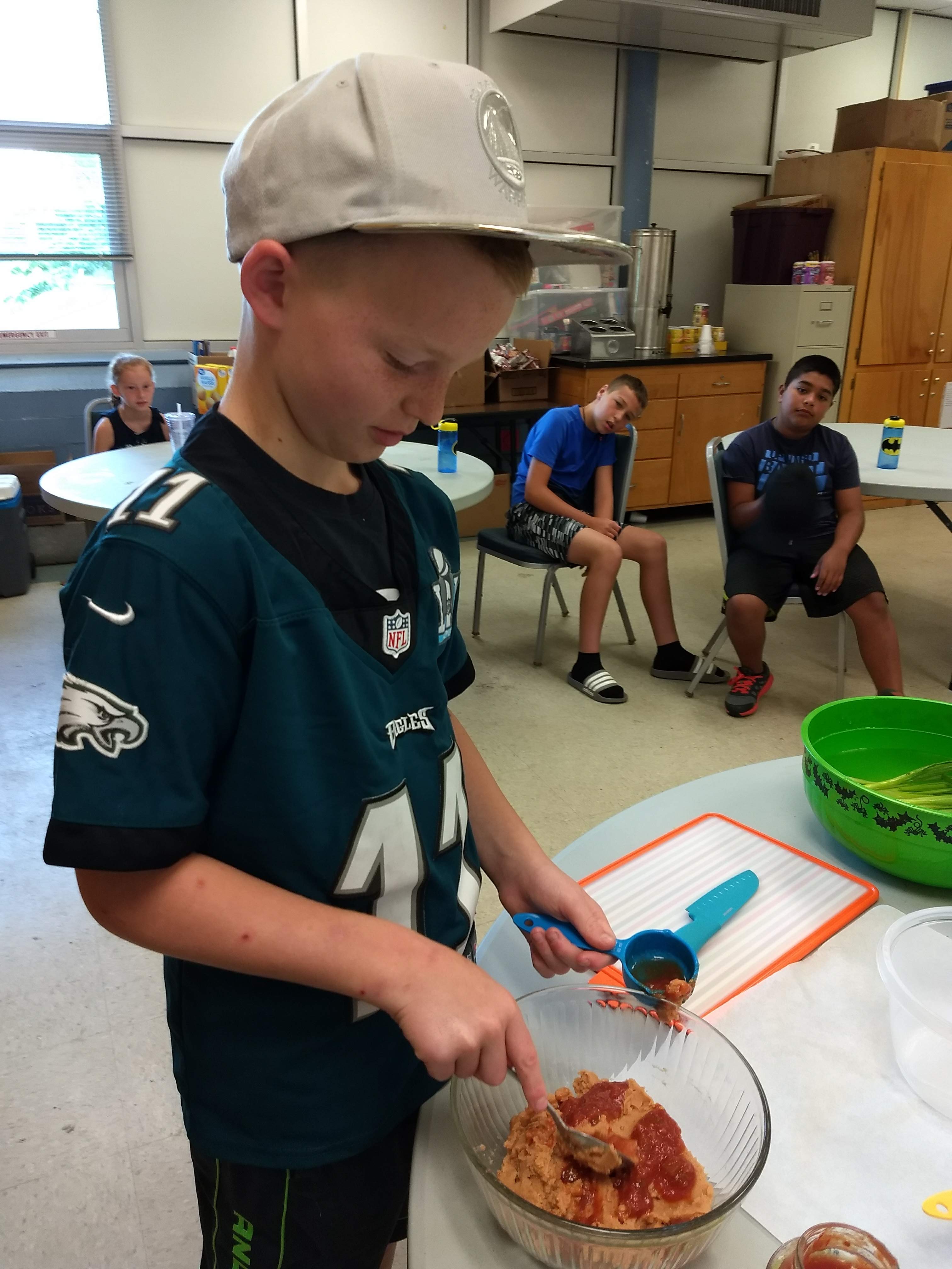 boy learning to cook