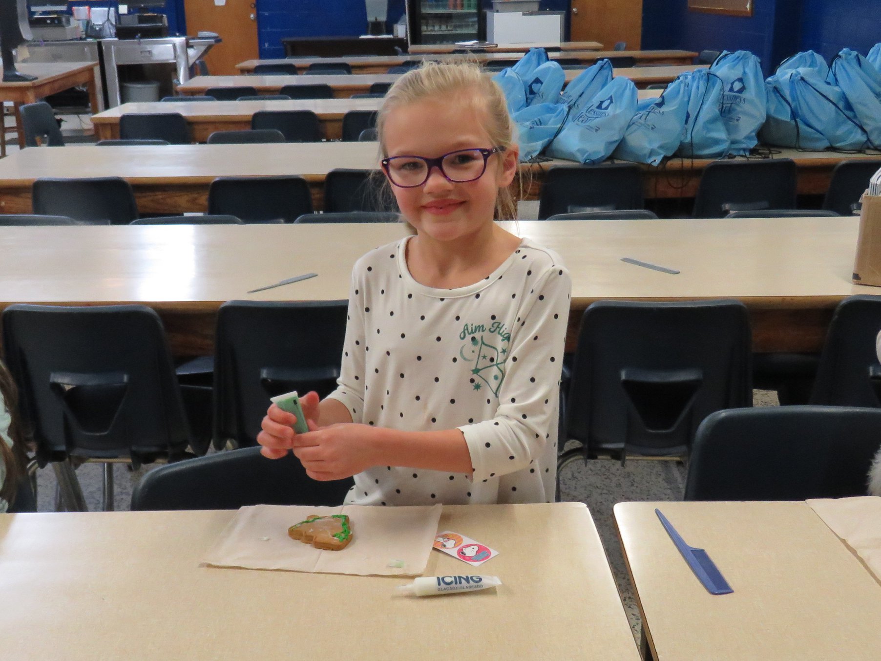 girl decorating a cookie