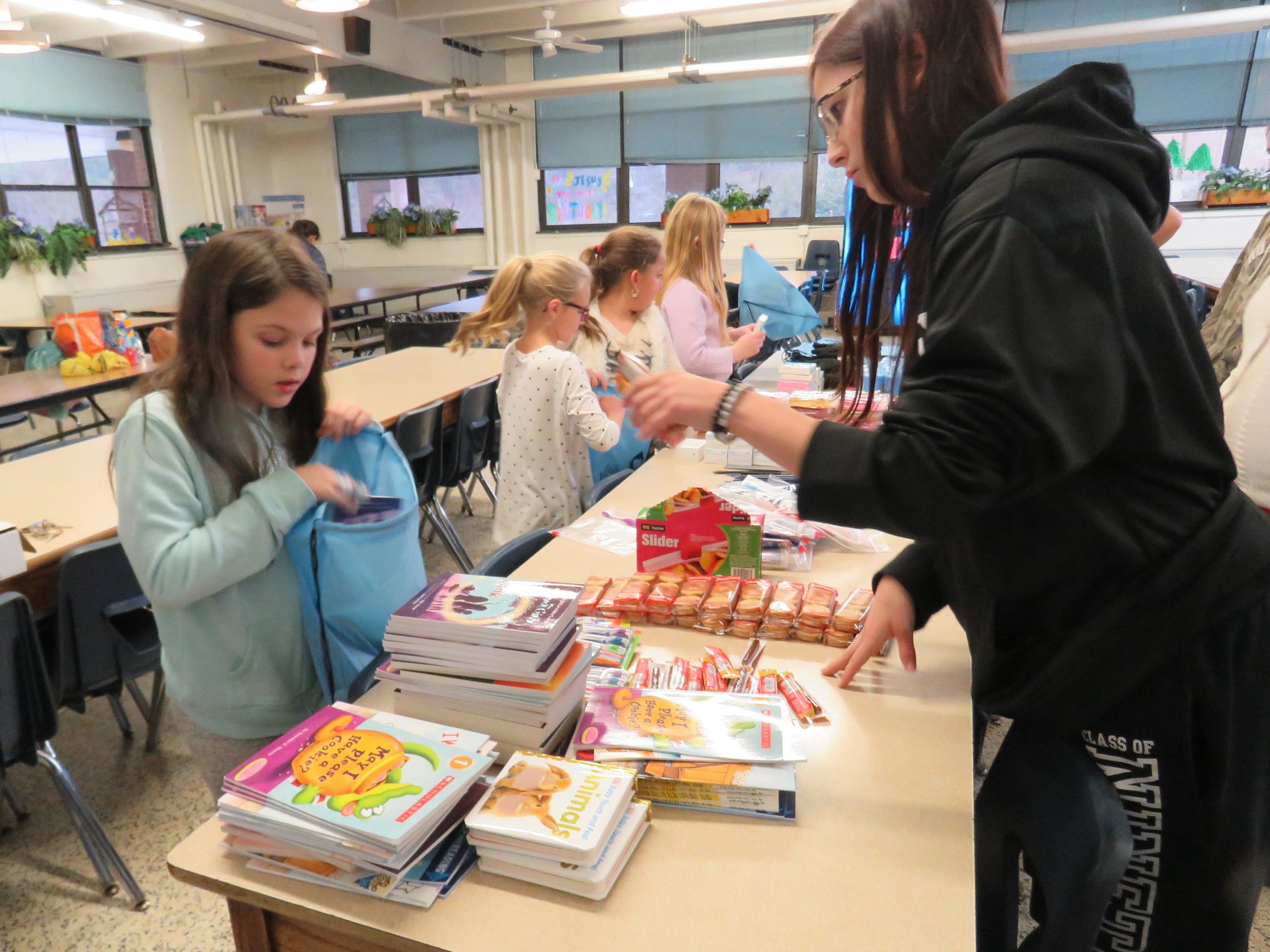 children filling bags