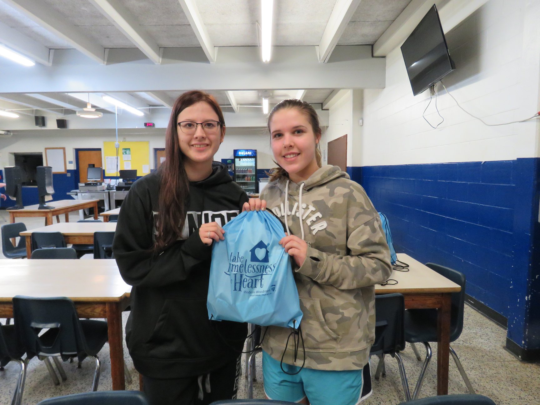youth with one of the hygiene packs for the homeless