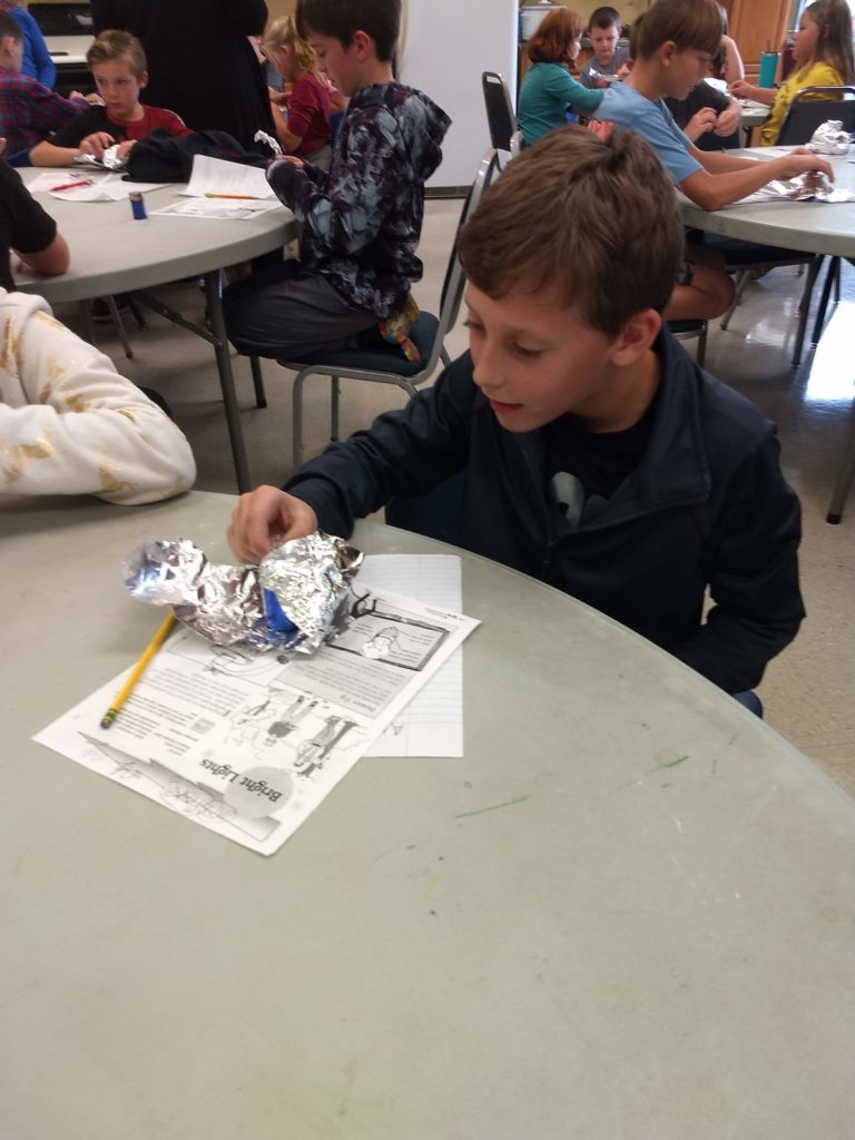 boy working on electric project