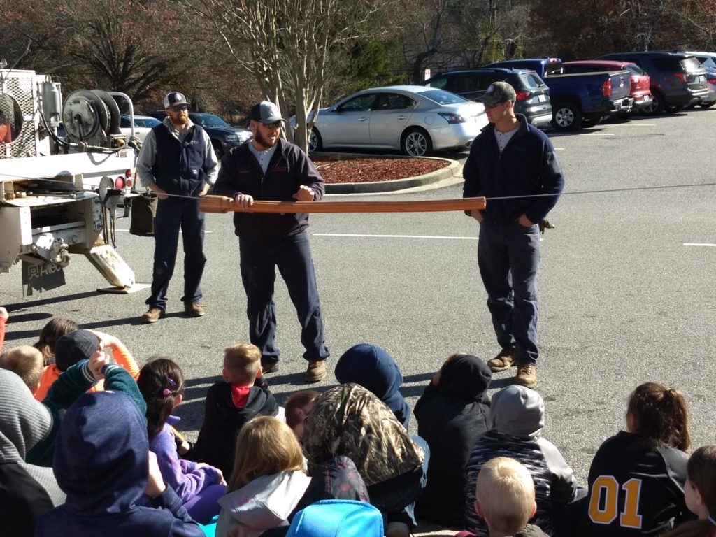 linemen teaching children