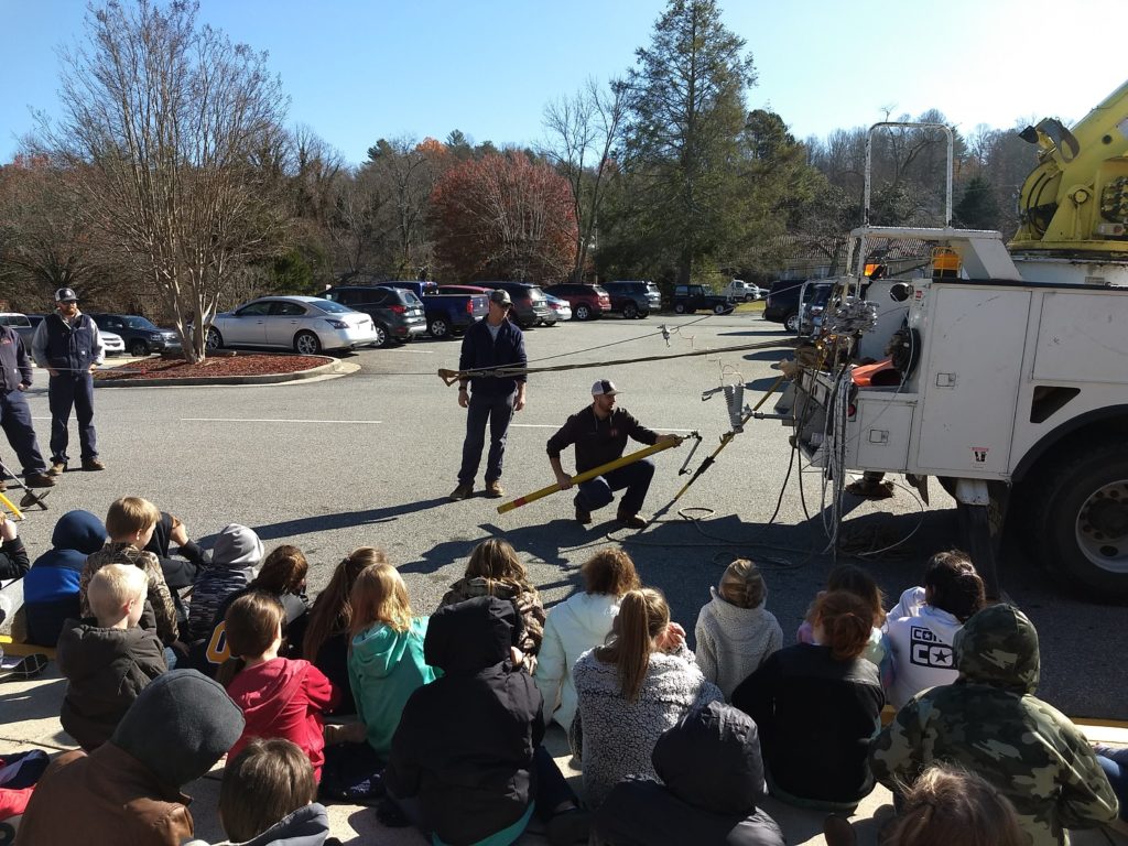 linemen providing a demonstration