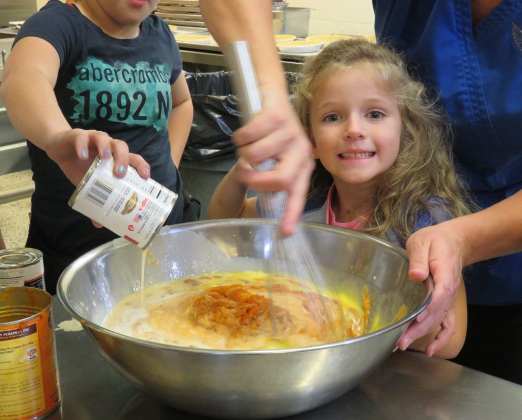 girl stirring ingredients