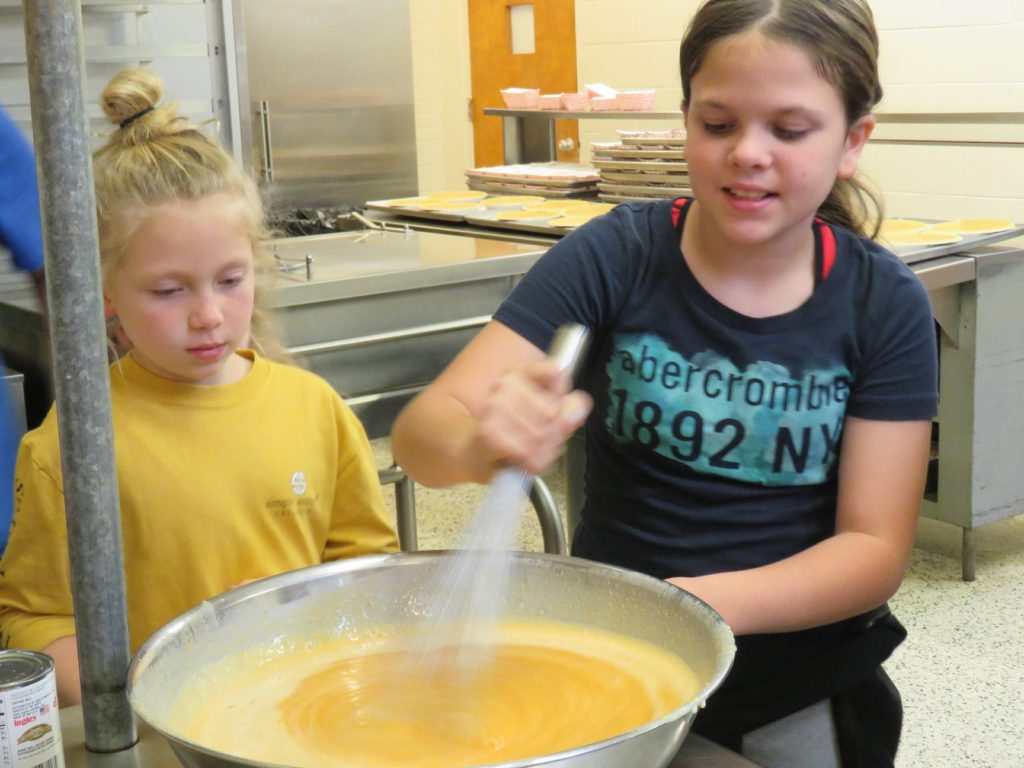 children stirring filling