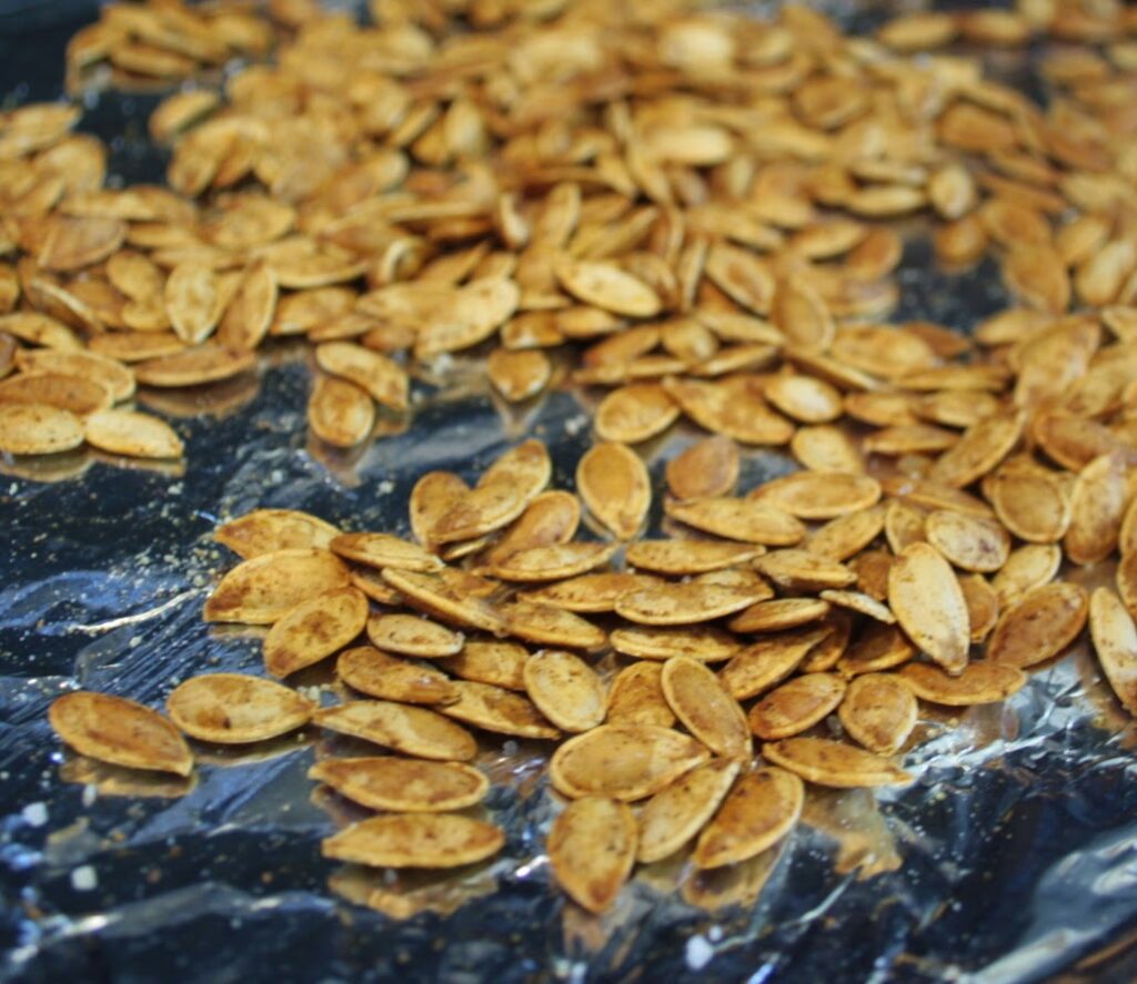 Roasted seeds on a sheet pan.